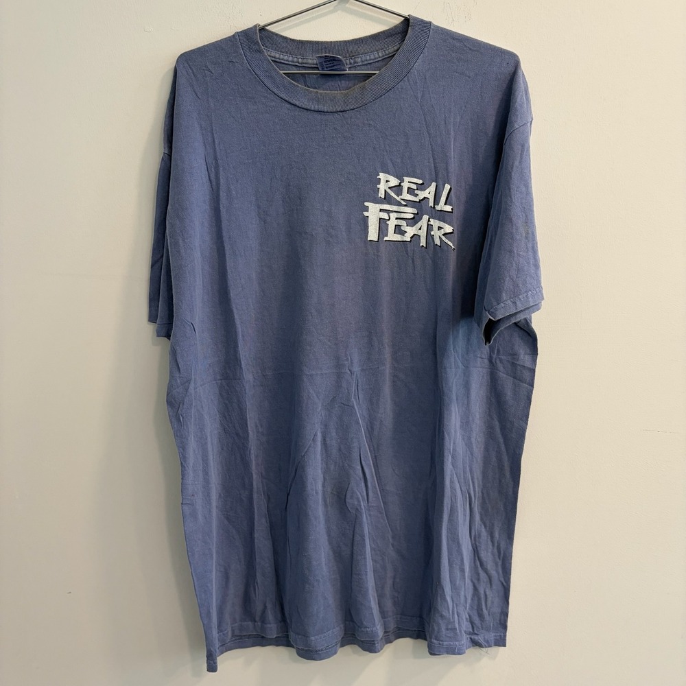 Real Fear He Who Dies With The Most Toys Still Dies Graphic T-Shirt Blue Large